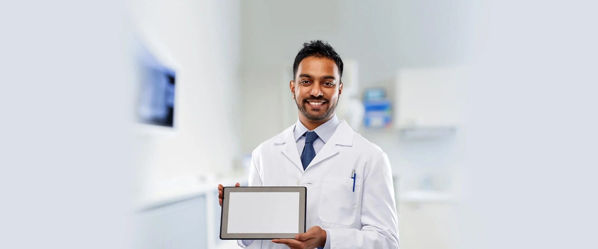 dentist holding tablet in hand